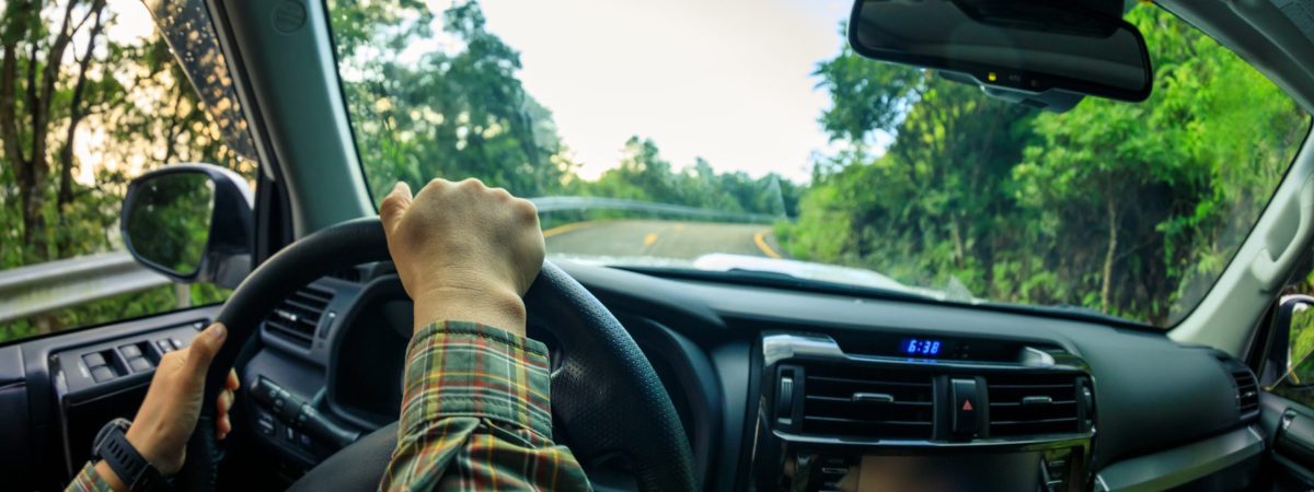 People driving car on mountain road